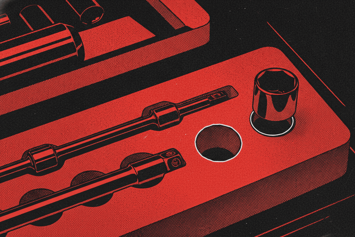 Red and black halftone illustration: a socket wrench set in a foam tray with exactly one socket lifted out and set beside it (TheNotificationApp)